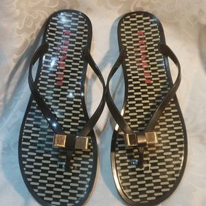 Coach plastic flip flops.